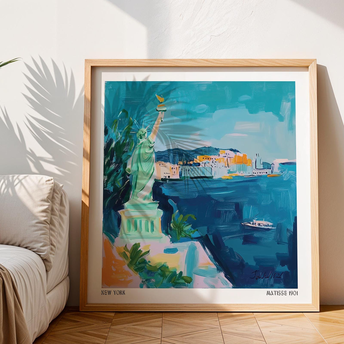 Holiday Posters framed print leaning on floor showing a watercolour Liberty statue with blue sea and sky next to a sofa