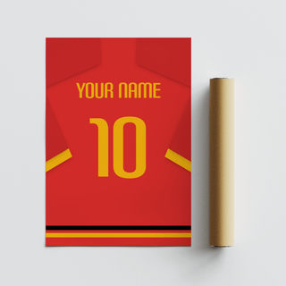 Rolled print and football shirt poster in red with yellow number and sleeve stripe on a flat surface