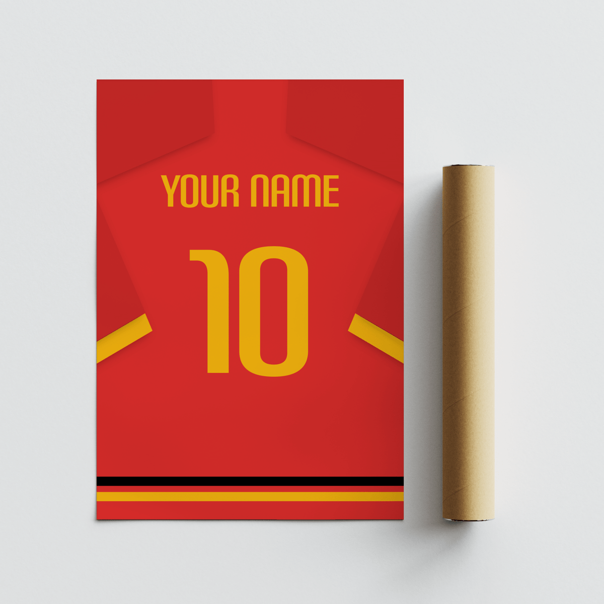 Rolled print and football shirt poster in red with yellow number and sleeve stripe on a flat surface