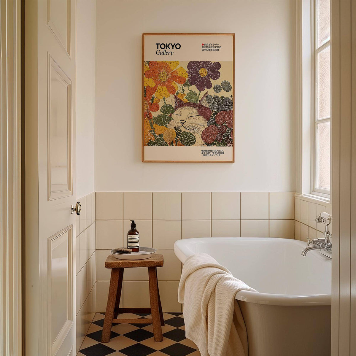 Japanese artwork print of a sleeping cat in orange and purple flowers above a wooden stool in a bathroom