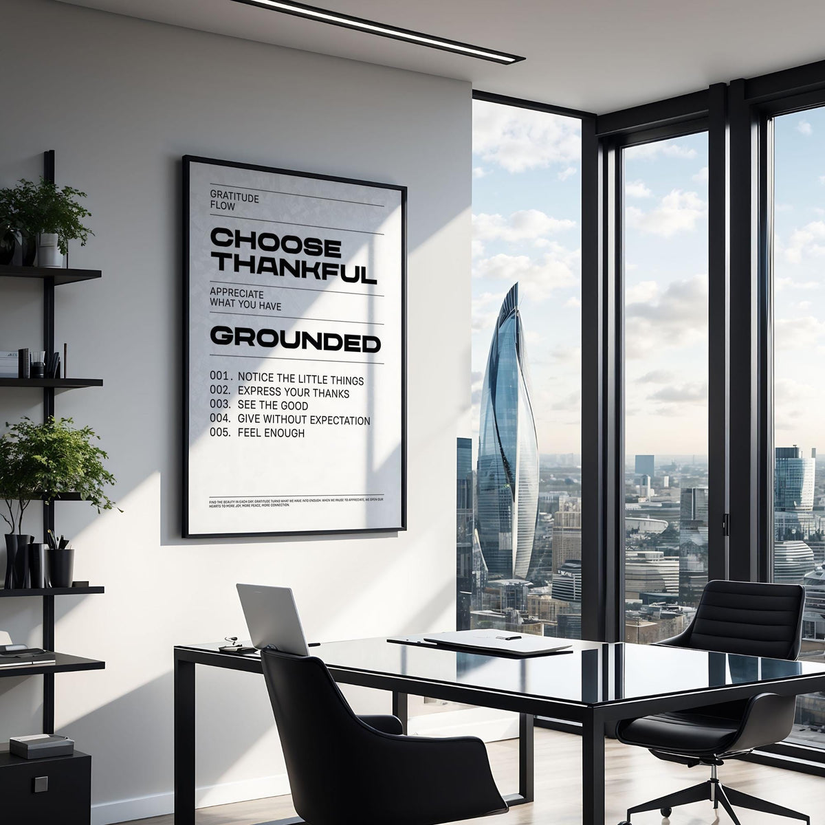 Gratitude wall art with black typographic text in a bright modern office by window with city view