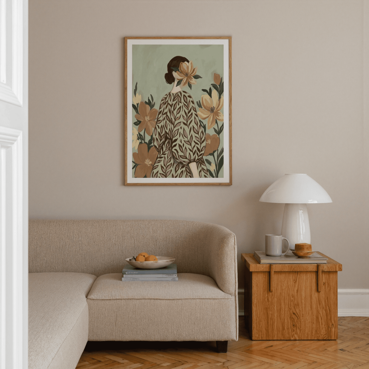 Woman With Flowers wall art of a woman with a floral pattern dress above a beige sofa in a neutral living room