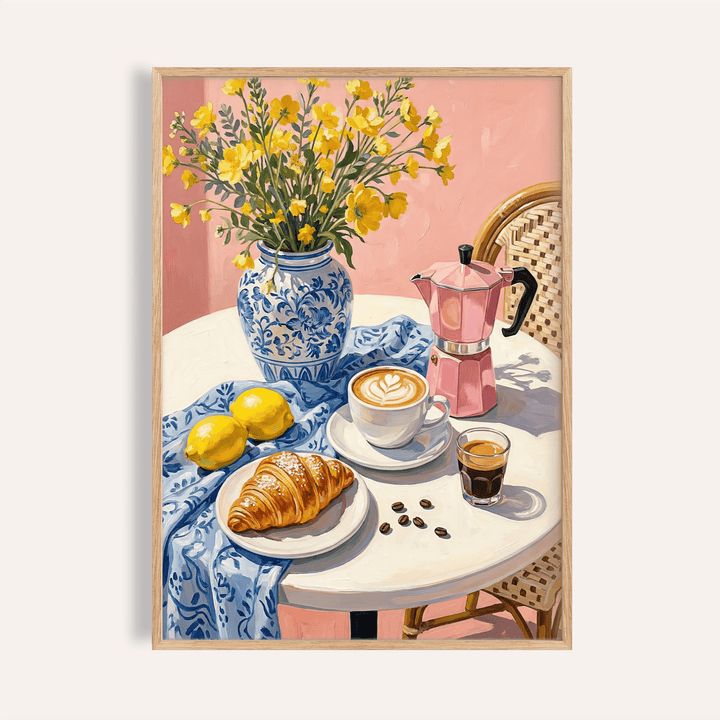 Framed Floral Kitchen Decor print showing yellow flowers in a blue vase on a table with coffee and pastry
