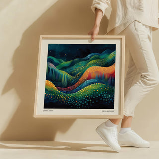Framed Scenic Wall Art of abstract colourful hills held by a person wearing white clothes