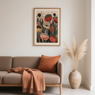 Art with Poppies framed print with stylised orange and beige flowers above a sofa with brown cushions