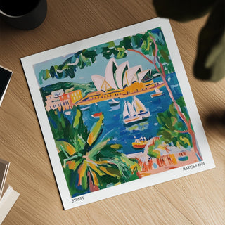 Matisse Art for Sale illustration of Sydney opera house and boats in vibrant blue and green tones on a wooden surface with a black cup