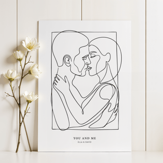 Print leaning on a shelf of an embracing couple in minimalist black line-art alongside a white flower