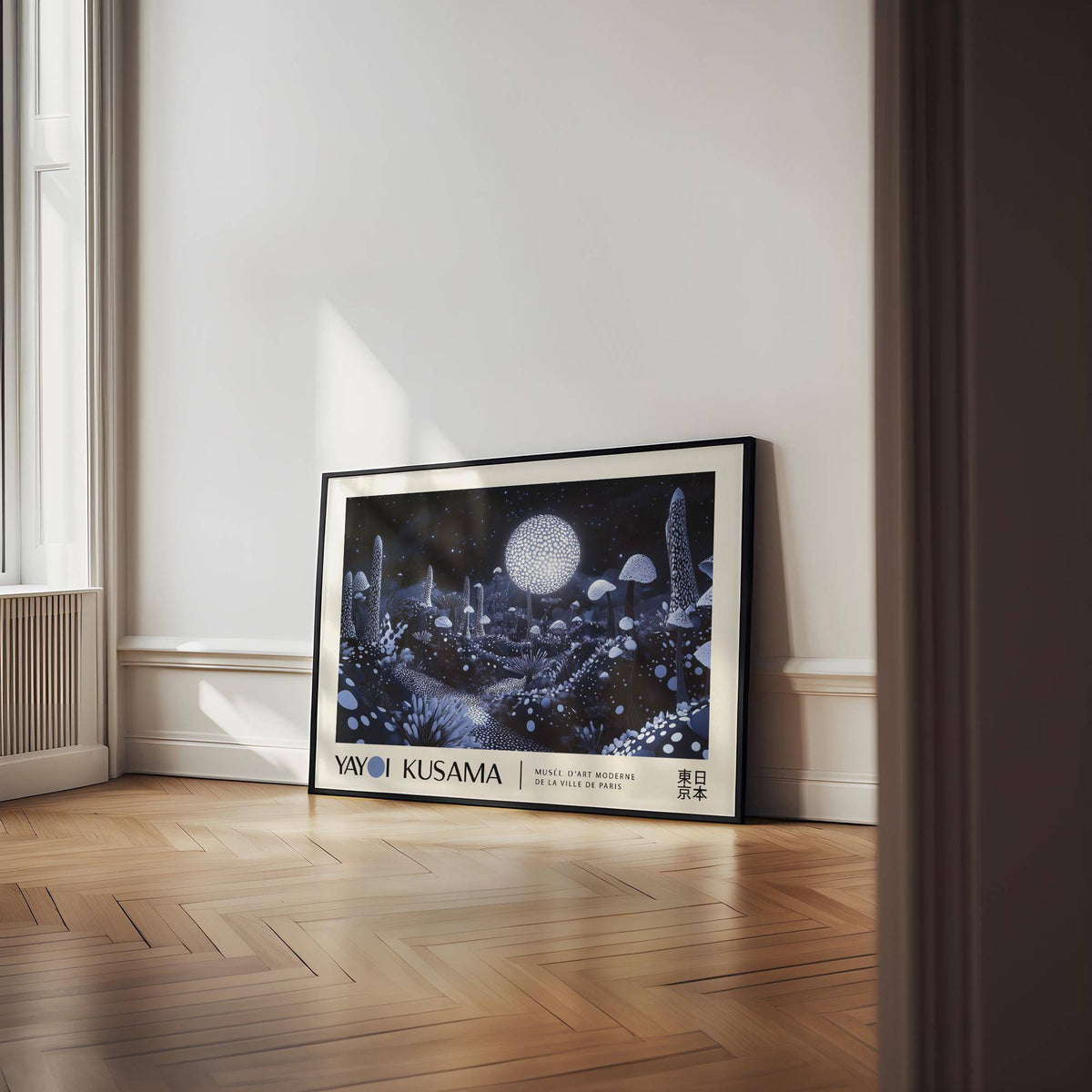 Print leaning on a wooden floor of luminous fungi illustration with a large glowing moon and dark background