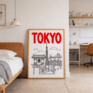 Tokyo City wall art with red text and line-art landmarks leaning against a wall beside a bed