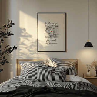 Heart on Map Print framed print on a bedroom wall with a black frame above a wooden bed