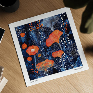 Abstract Flower Art print with coral dots and blue floral illustration on a wooden surface near a black cup