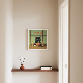Ramen Cat Art print on a wall in a hallway above a wooden shelf with books and a vase