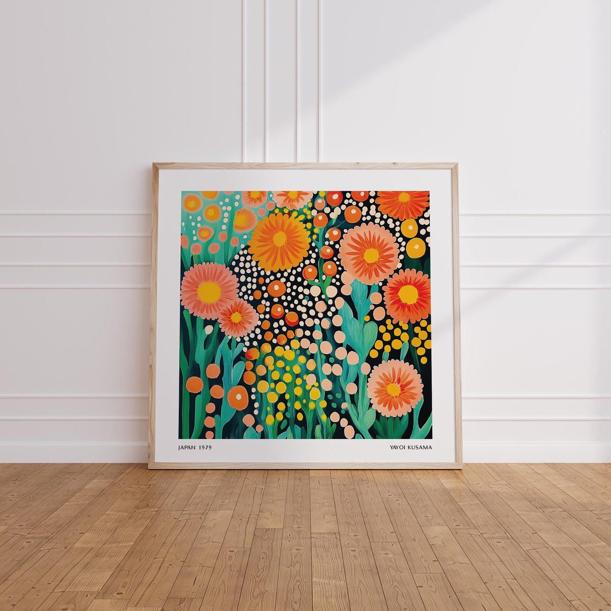 Framed Colorful Flower Art leaning on floor with bright orange and pink abstract flowers and green leaves