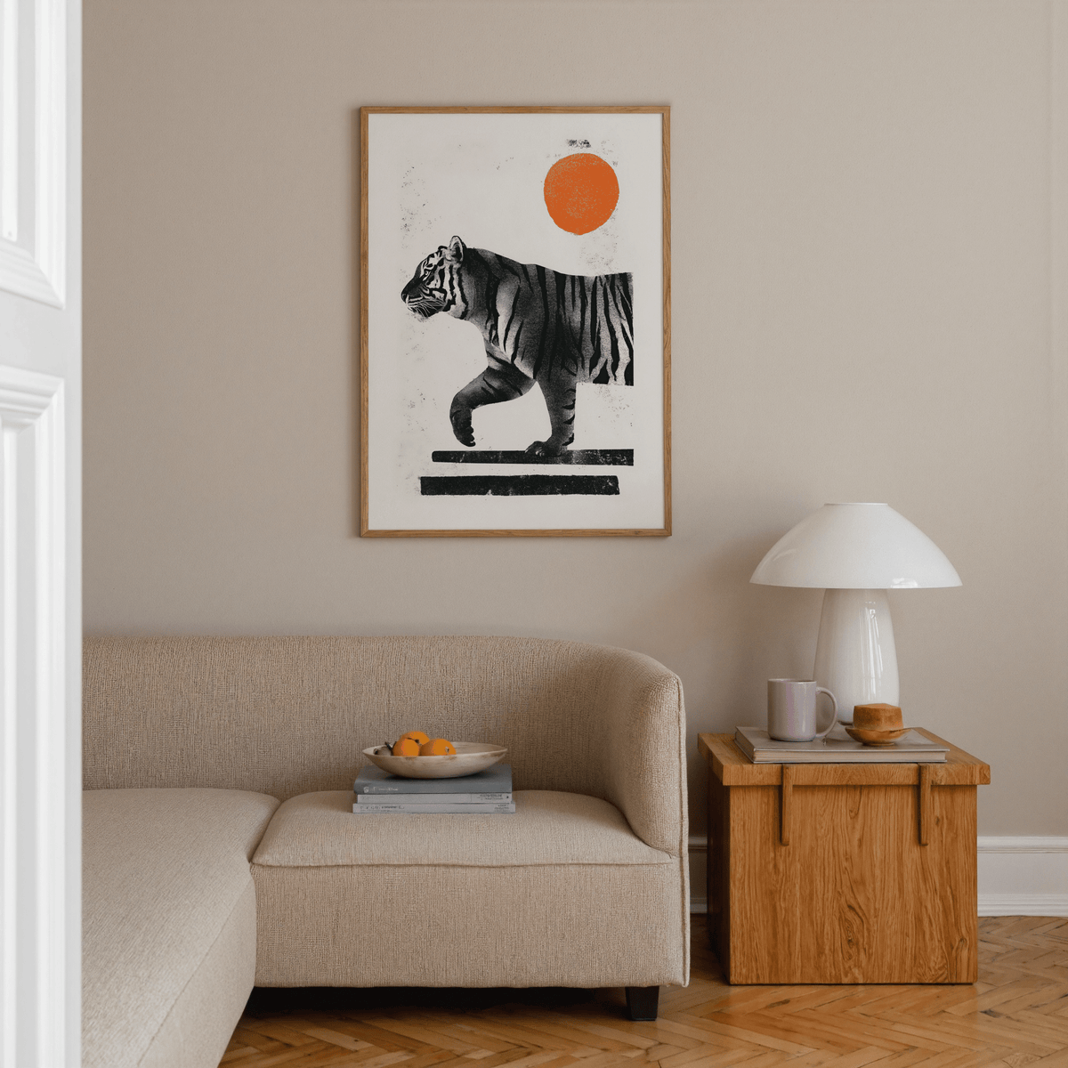 Indian Tiger Print showing a walking tiger with an orange sun above a beige sofa and wooden side table