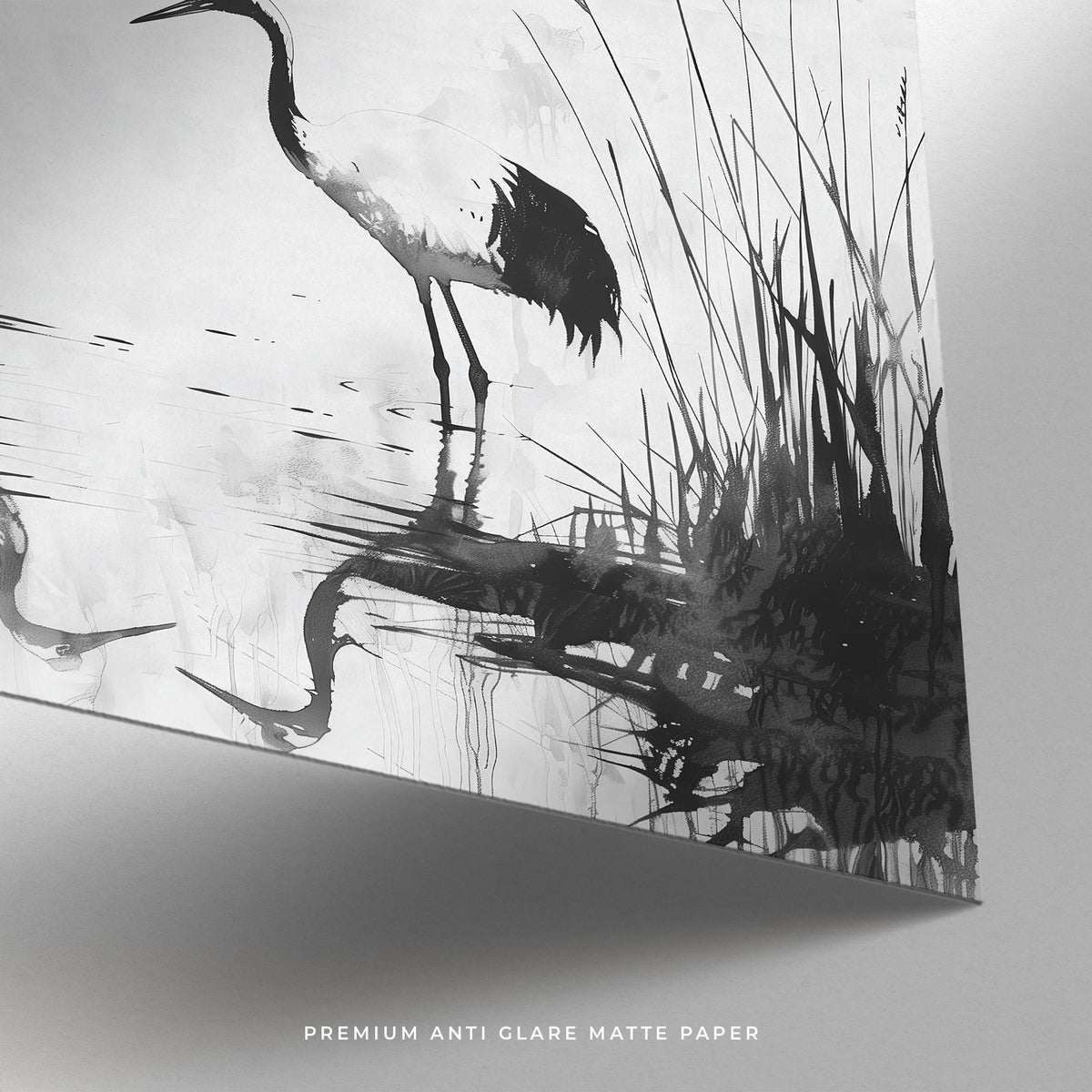 Minimalist bird art close-up of a black and white crane and reed reflections on matte paper