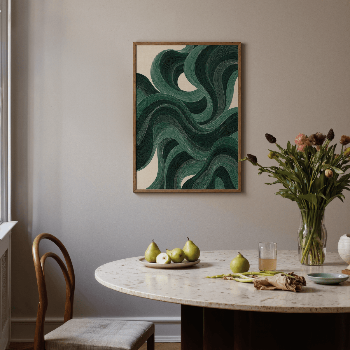 Modern Swirl Poster framed print with green swirl pattern above dining table with pears and vase of flowers