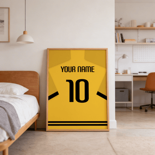 Football Shirt Poster in Yellow with Black Sleeve Stripes leaning on bedroom floor with wooden bed frame