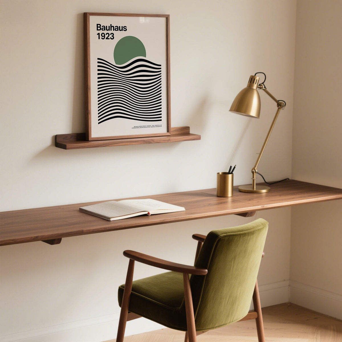 Print leaning on a shelf featuring a green circle with black wavy lines above a wooden desk and olive green chair