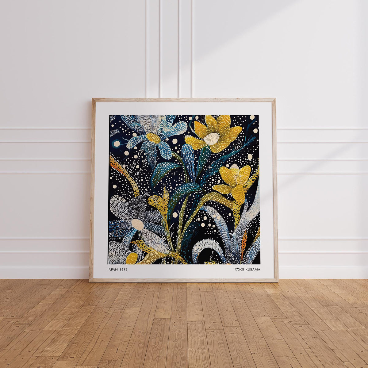 Dark Floral Wall Art leaning on wooden floor against white wall with floral abstract shapes in yellow and blue