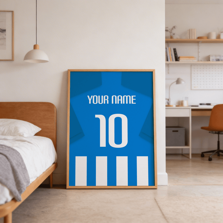 Framed blue and white striped football shirt poster with name and number leaning on bedroom floor