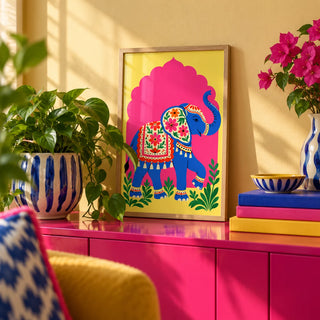 Elephant Art Print, a small A4 framed print leaning on a colourful lacquered shelf in a living room