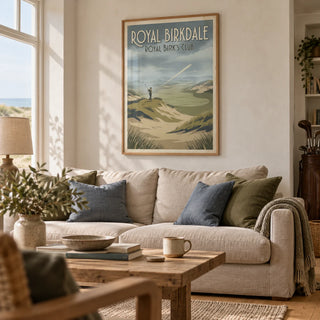 English Links Golf Art, framed on the wall of a relaxed living room in a golf lover's coastal UK home with a pale plaster wall and honey oak floor