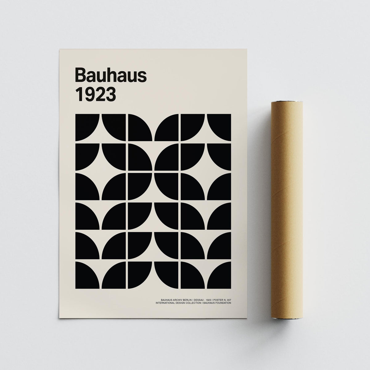 Mid Century Art Prints showing a monochrome Bauhaus geometric pattern with a packaging tube next to it