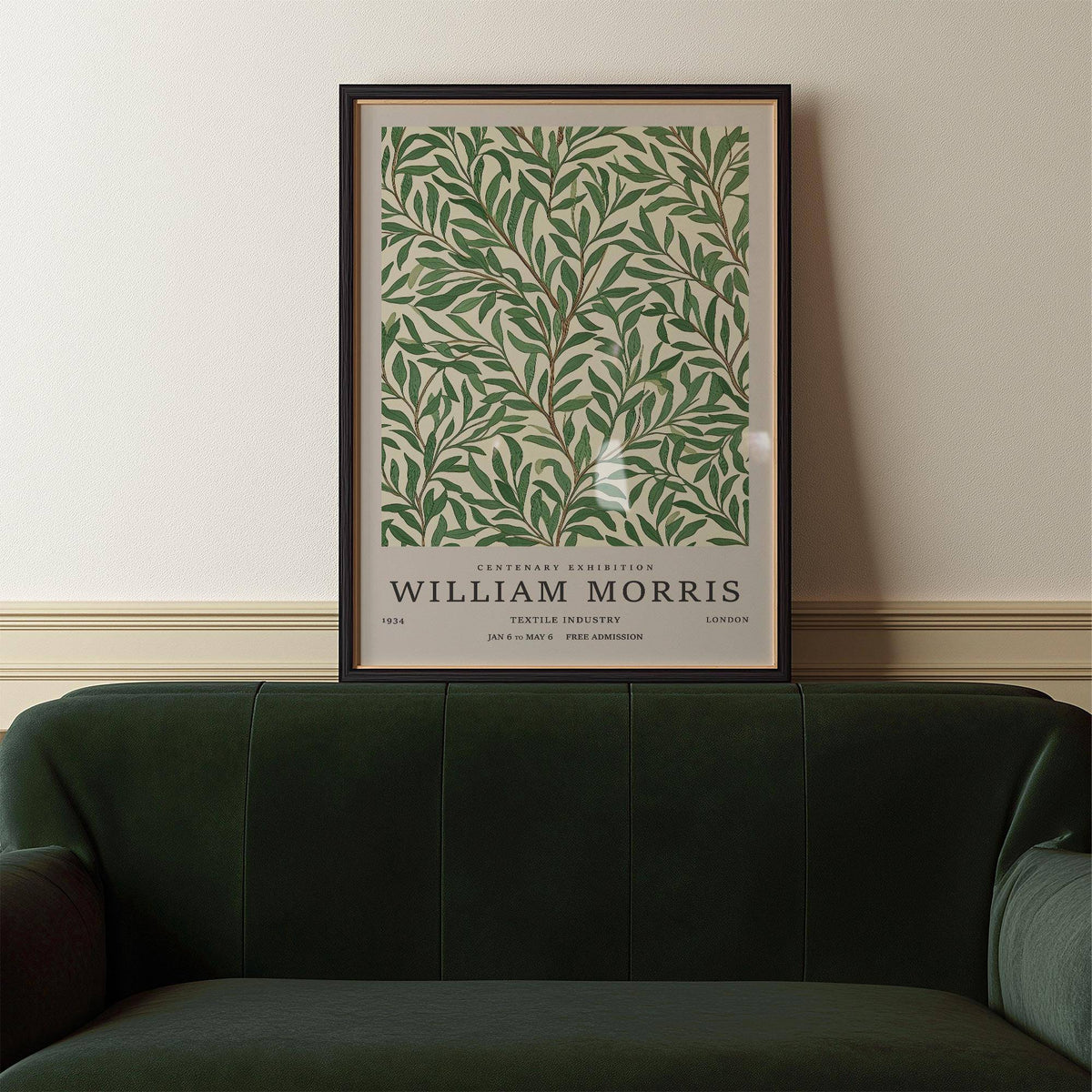 Classic Art Posters print of willow branches above a dark green velvet sofa