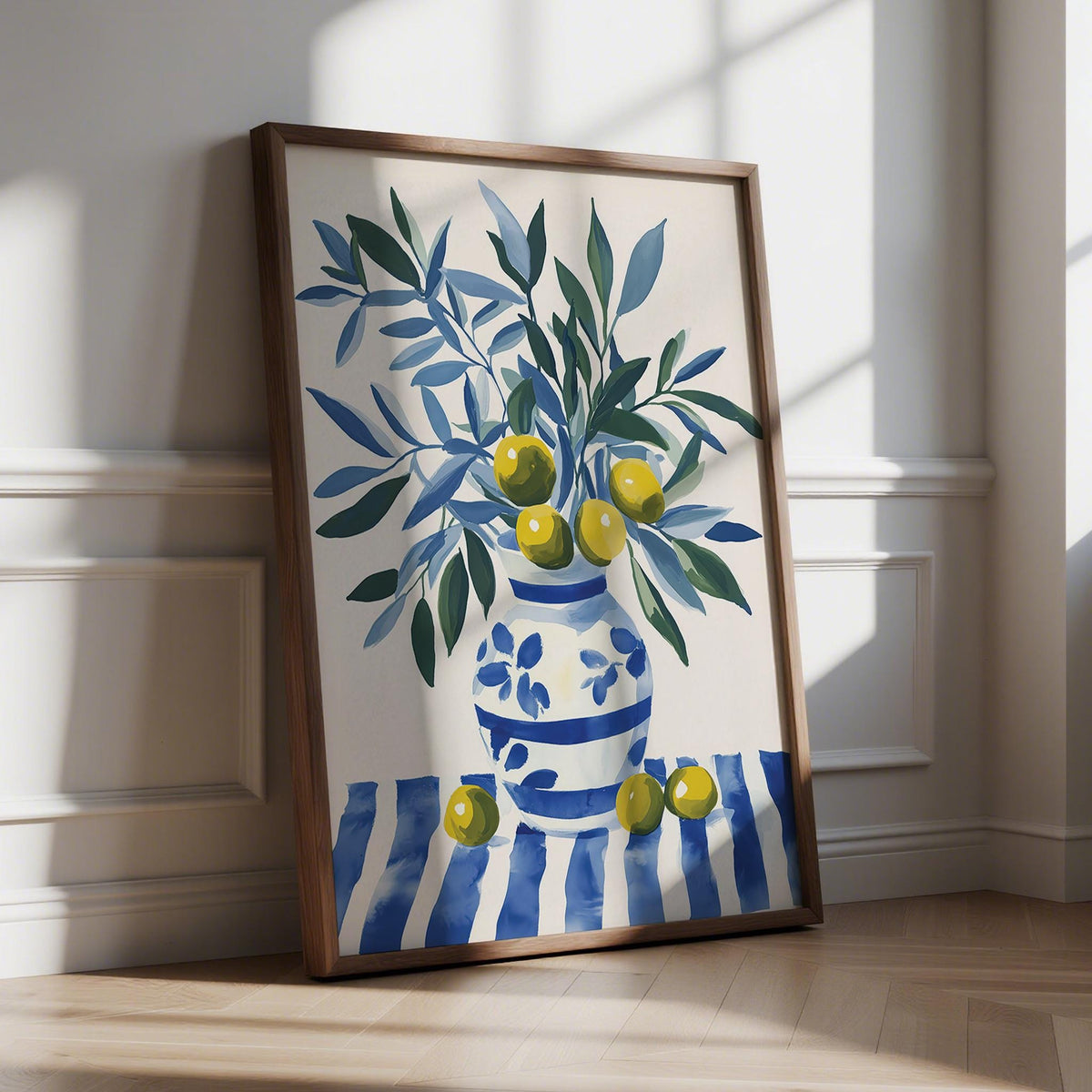 Olive Tree wall art with blue and green leaves and yellow olives in a vase leaning on wooden floor