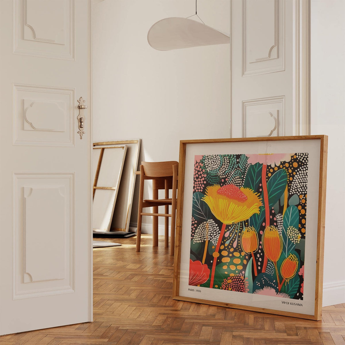 Floral Prints for Framing print leaning on floor with wooden chair in background