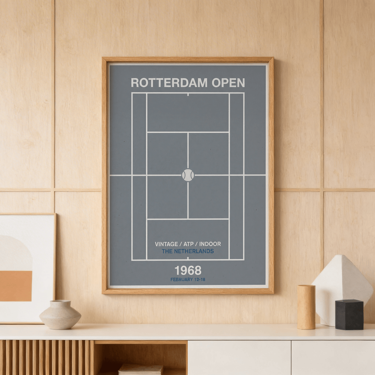 Framed Rotterdam Open Poster with a minimalist tennis court diagram in blue and white on a wooden wall