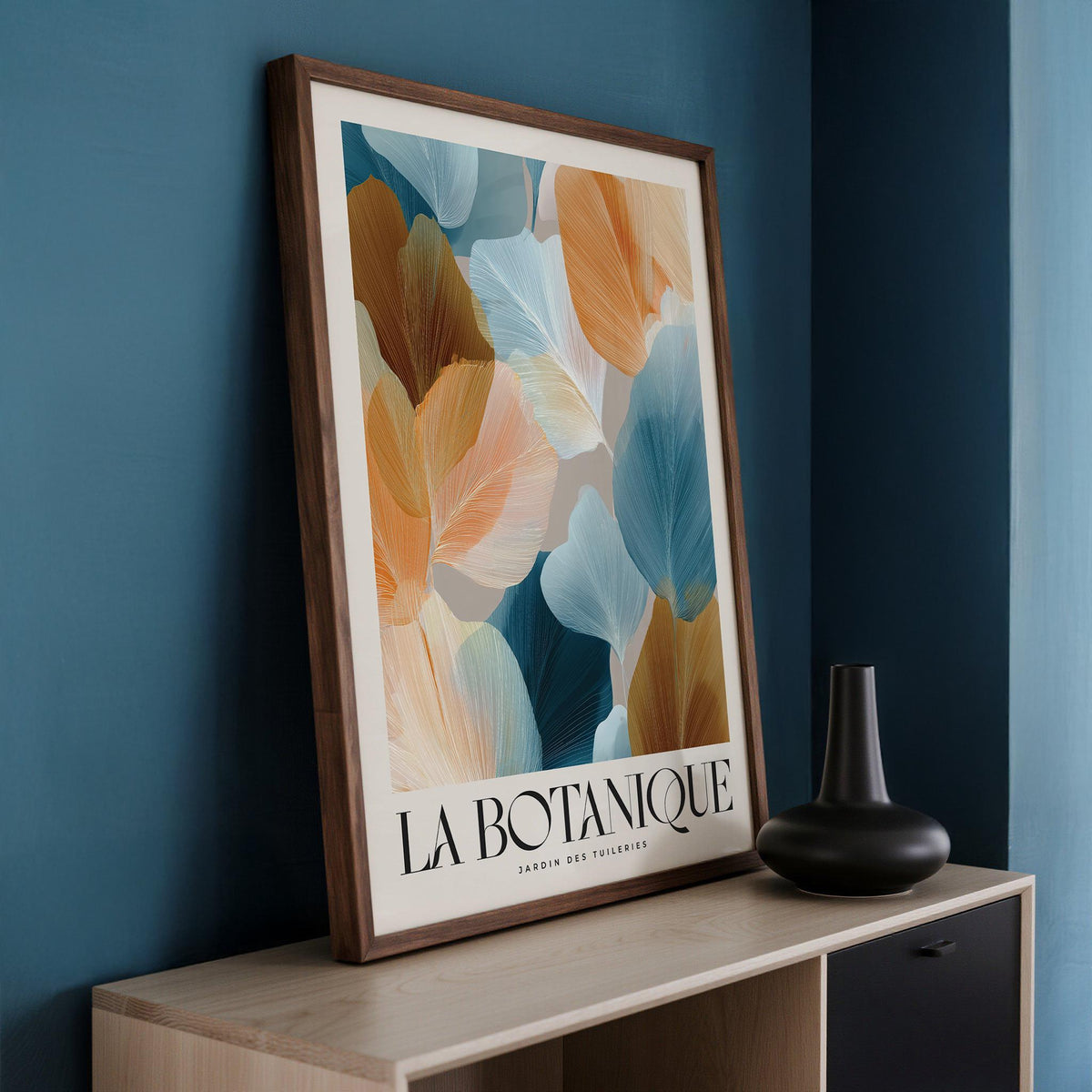 Framed Flower Art for Walls with abstract botanical leaves in warm orange and cool blue tones on a cabinet