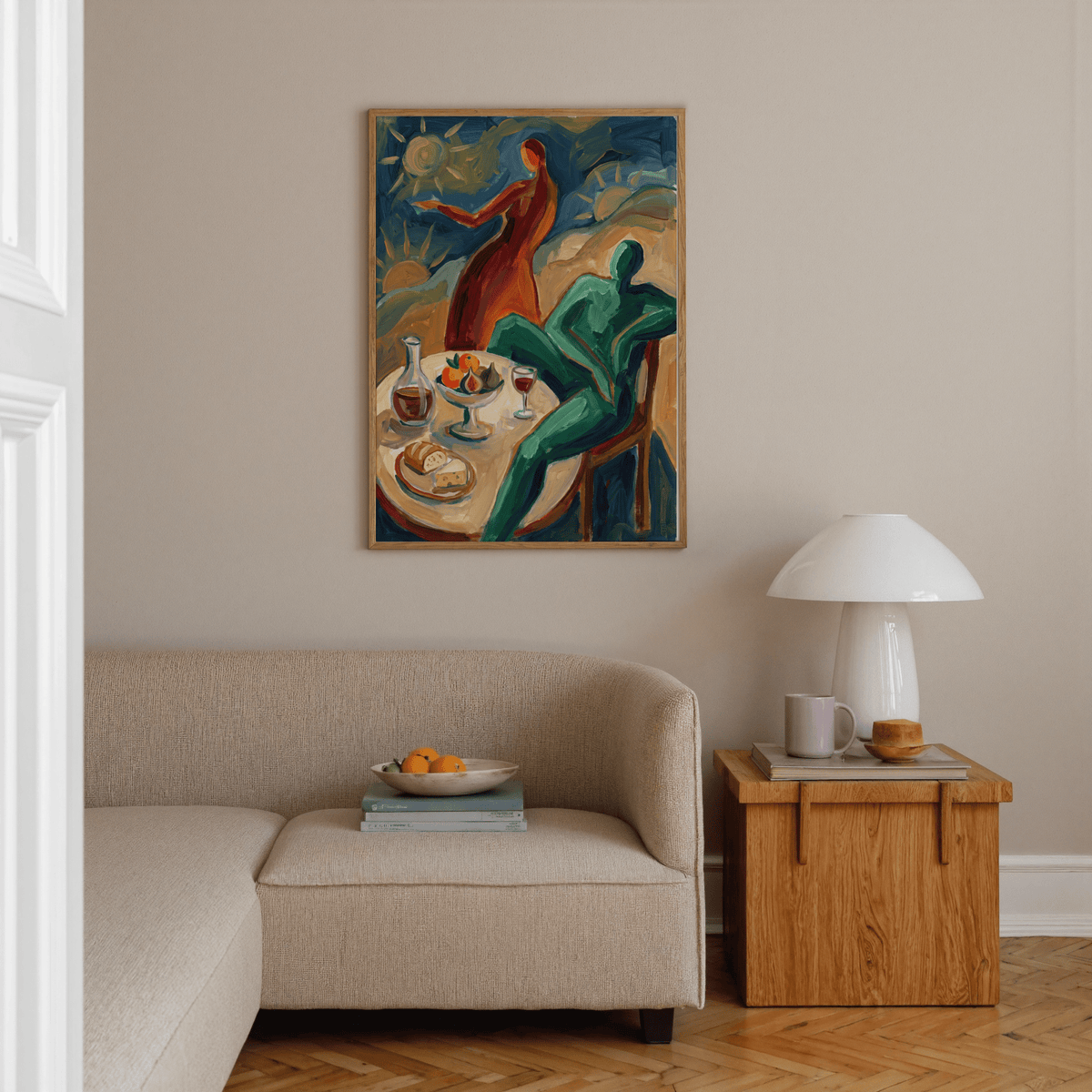 Dining Scene wall art of abstract figures by a table with bread and wine above a sofa