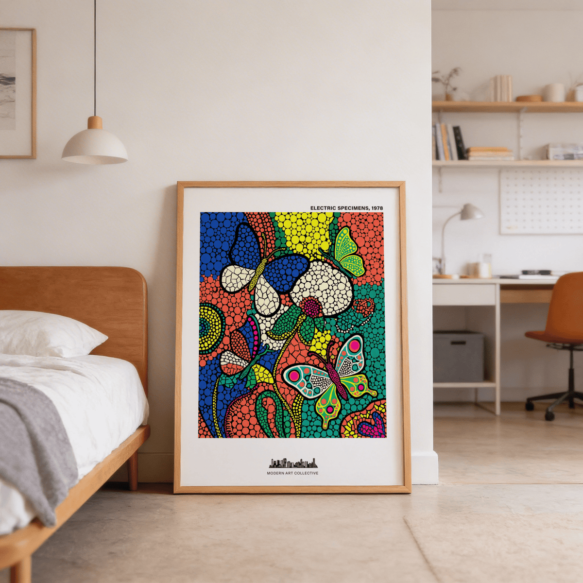 Colorful Butterfly Art Print leaning against a wall next to a wooden bed in a modern bedroom