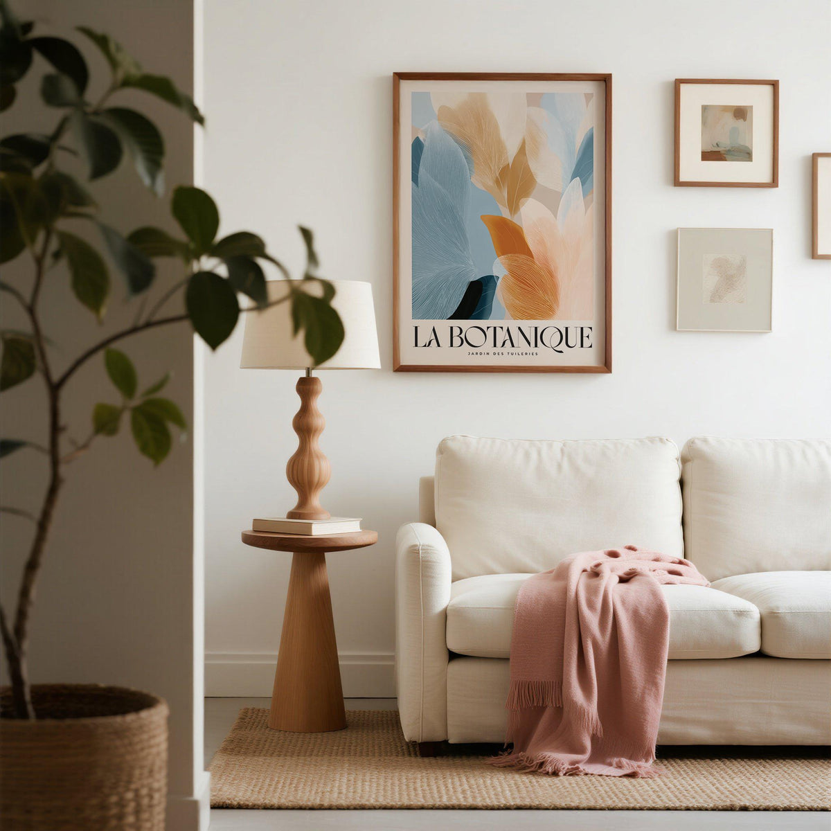 Blue Pink wall art of abstract botanical leaves in soft blue and pink tones above a wooden side table and lamp