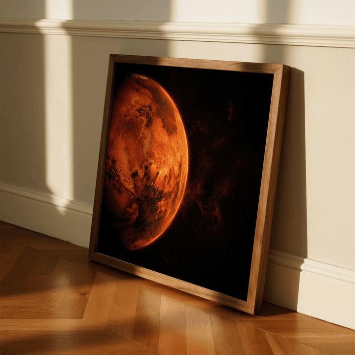 Print leaning on floor of Mars wall art showing planet with vibrant orange and dark space background