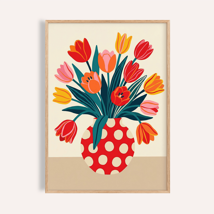 Framed floral art print of a tulip bouquet with orange yellow and pink flowers in a red polka dot vase