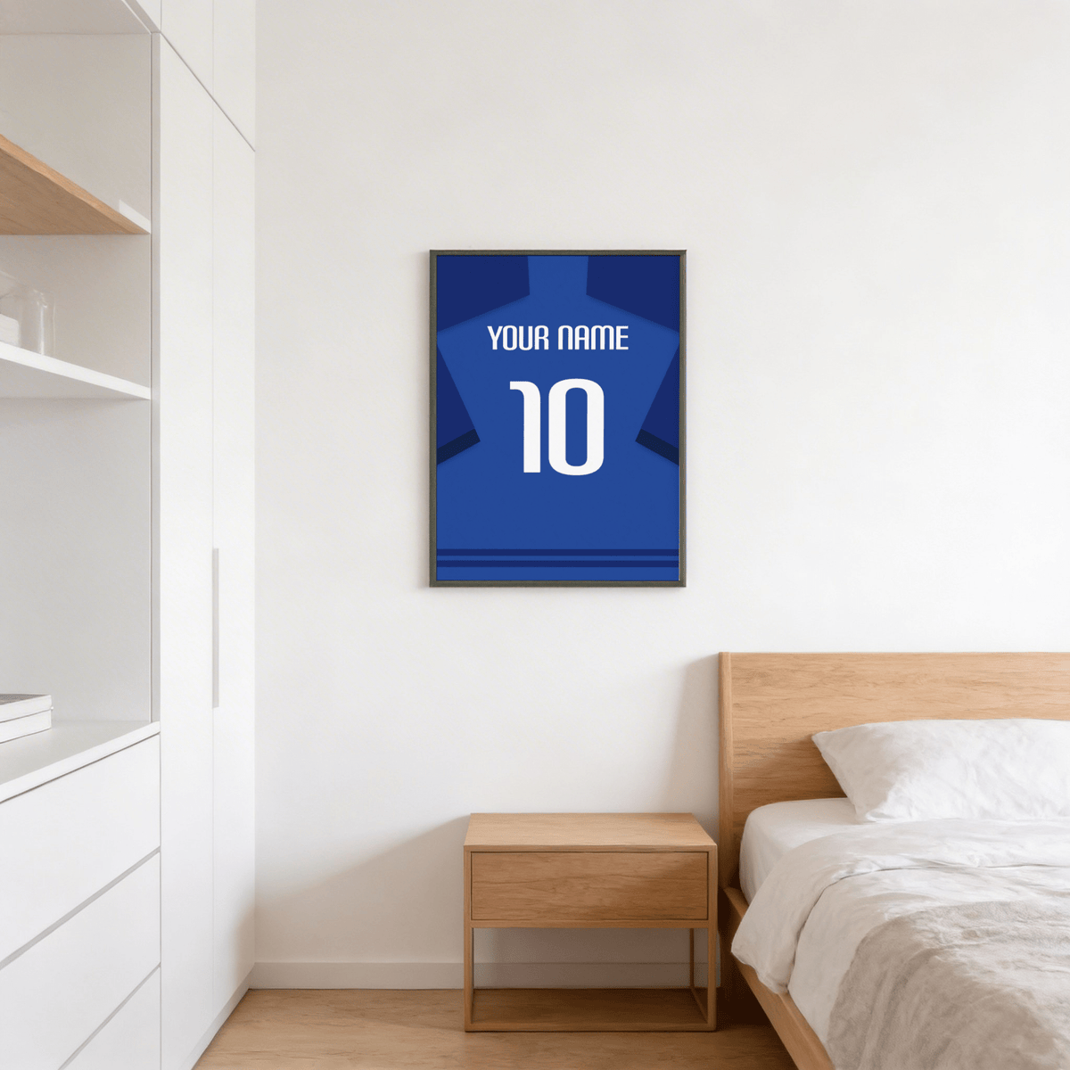 Football Shirt Poster in Blue with Dark Blue Sleeves and White Number on bedroom wall above a wooden bedside table