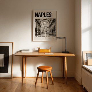 Galleria Umberto art print above a wood desk with orange organiser and black lamp in a room