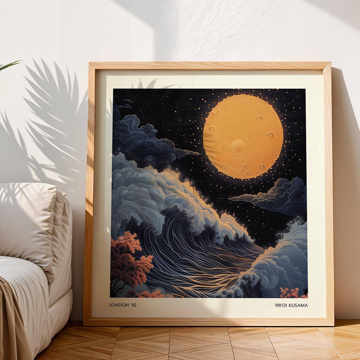 Japanese Art Pictures print of a surreal full orange moon and waves leaning against a wall by a sofa