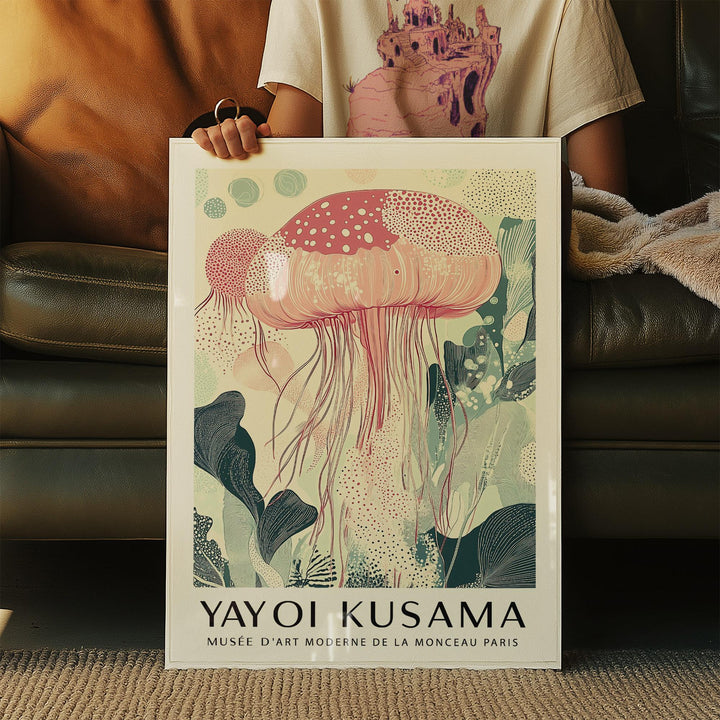 Sea Animal wall art held in hands showing pink jellyfish illustration with green and beige details