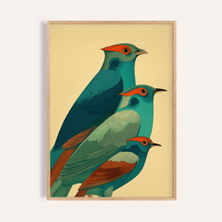 Colorful bird art print of three stylized teal birds with orange accents in a wood frame