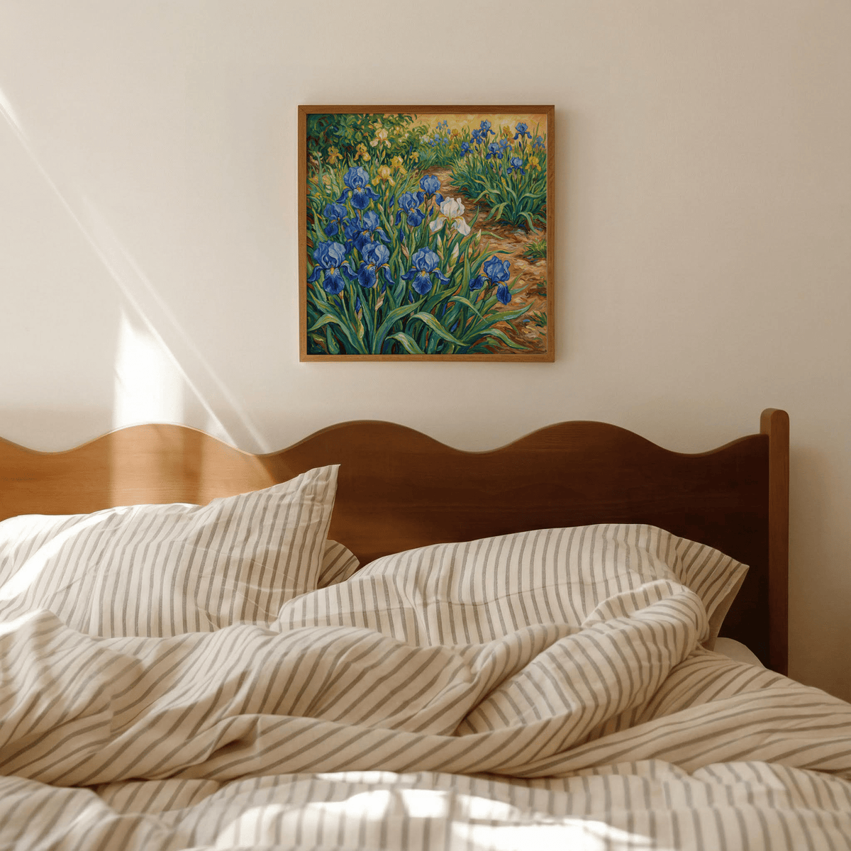 Blue Iris Art Print hanging above bed showing blue and yellow iris flowers in a wooden frame