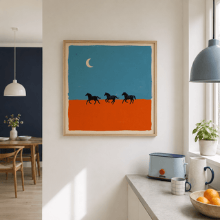 Horse silhouette wall art of running horses with a blue and orange background in a kitchen