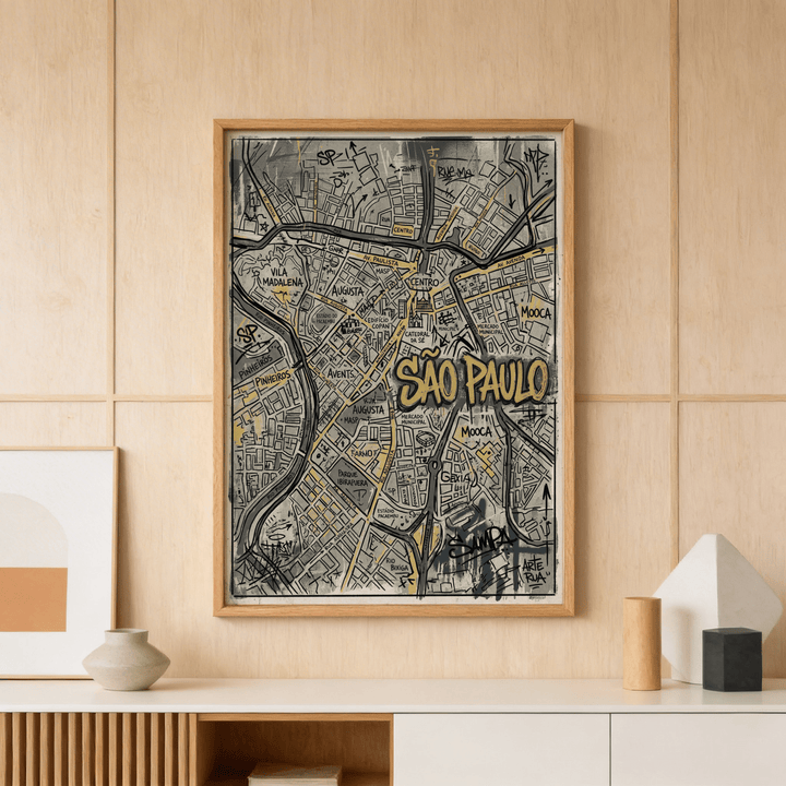 Print on a wall in a room of Sao Paulo map art graffiti style with black and yellow details above a shelf with pottery and decor