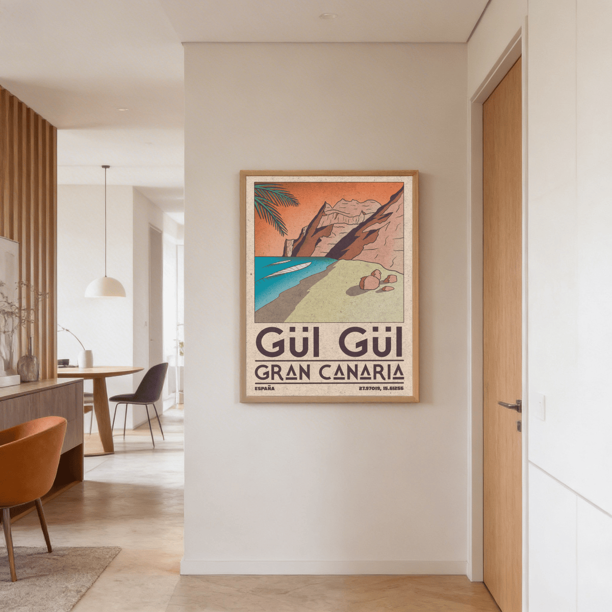 Gran Canaria Beach Art Print showing beach cliffs and turquoise sea in mid-century style in a hallway with a wooden door