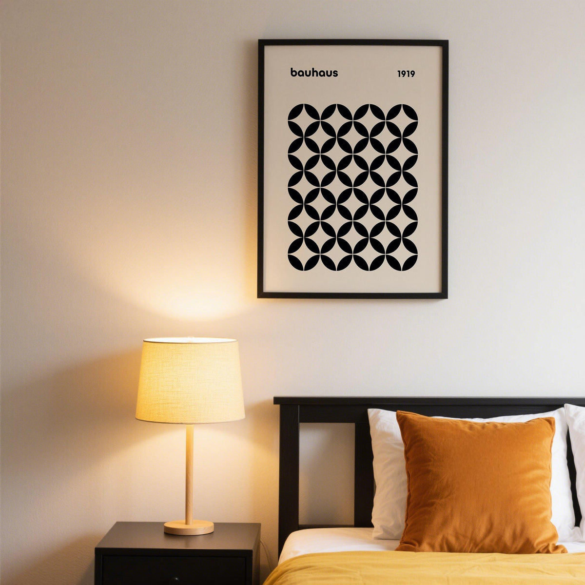 Mid Century Wall Print of a black geometric grid in bauhaus style above a black bed with a brown cushion