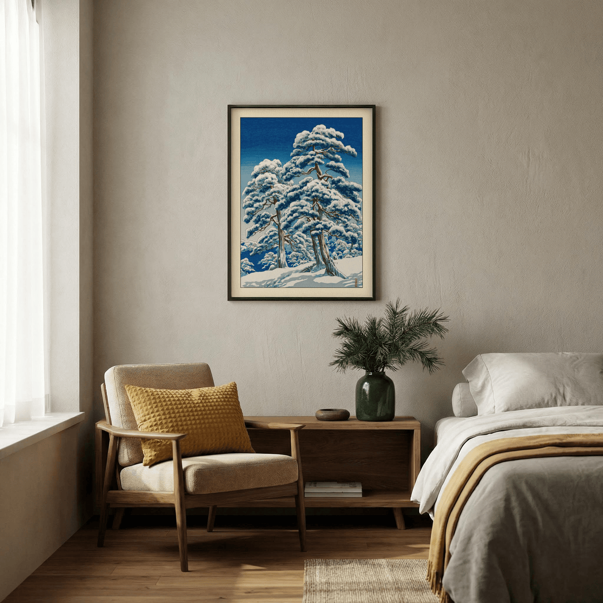 Hasui Kawase Winter Landscape Print hanging on a wall above a wooden sideboard with a vase in a bedroom