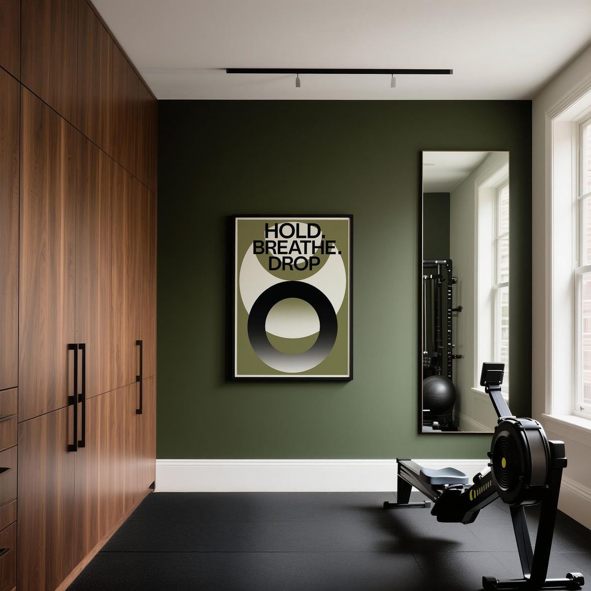 Home Gym Wall Art with typographic abstract design in green black and cream on a green wall with a rowing machine