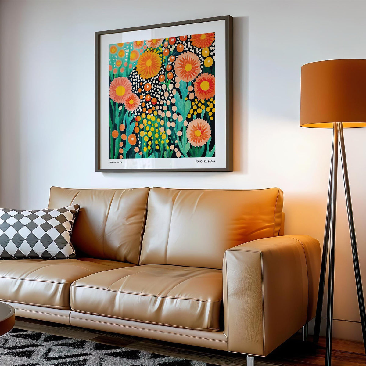 Colorful Flower Art framed print with bright abstract flowers above a tan leather sofa